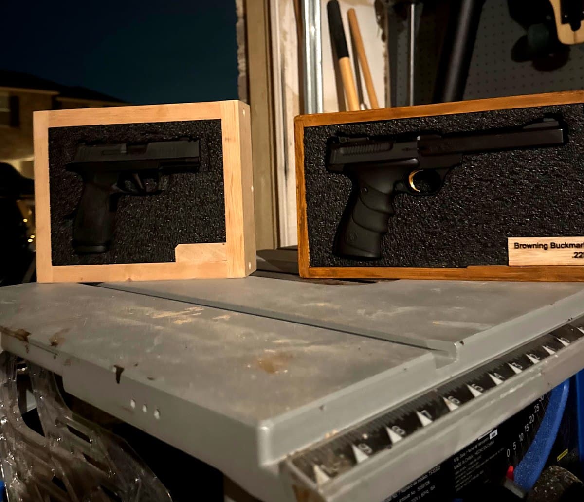 Two custom gun display cases in the workshop