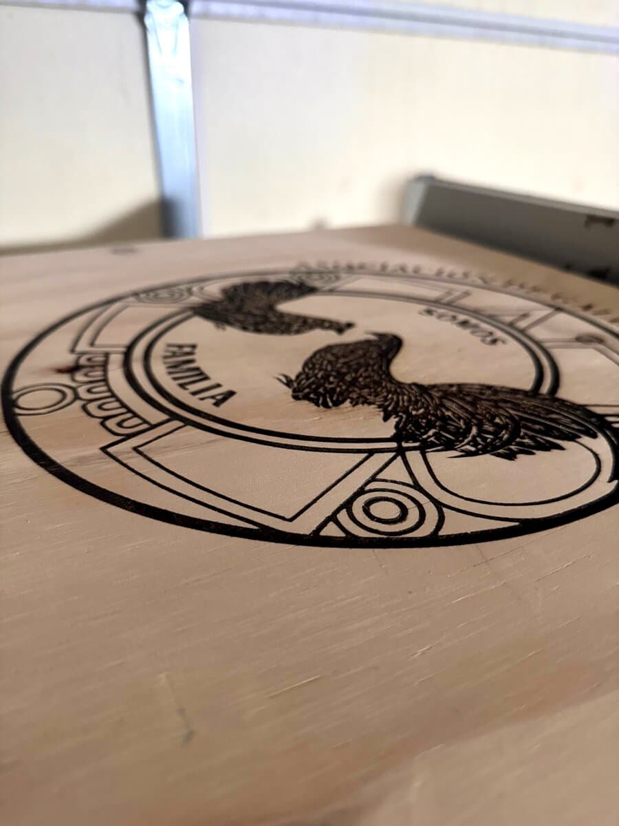 Familia rooster crest laser engraved on round wood plaque