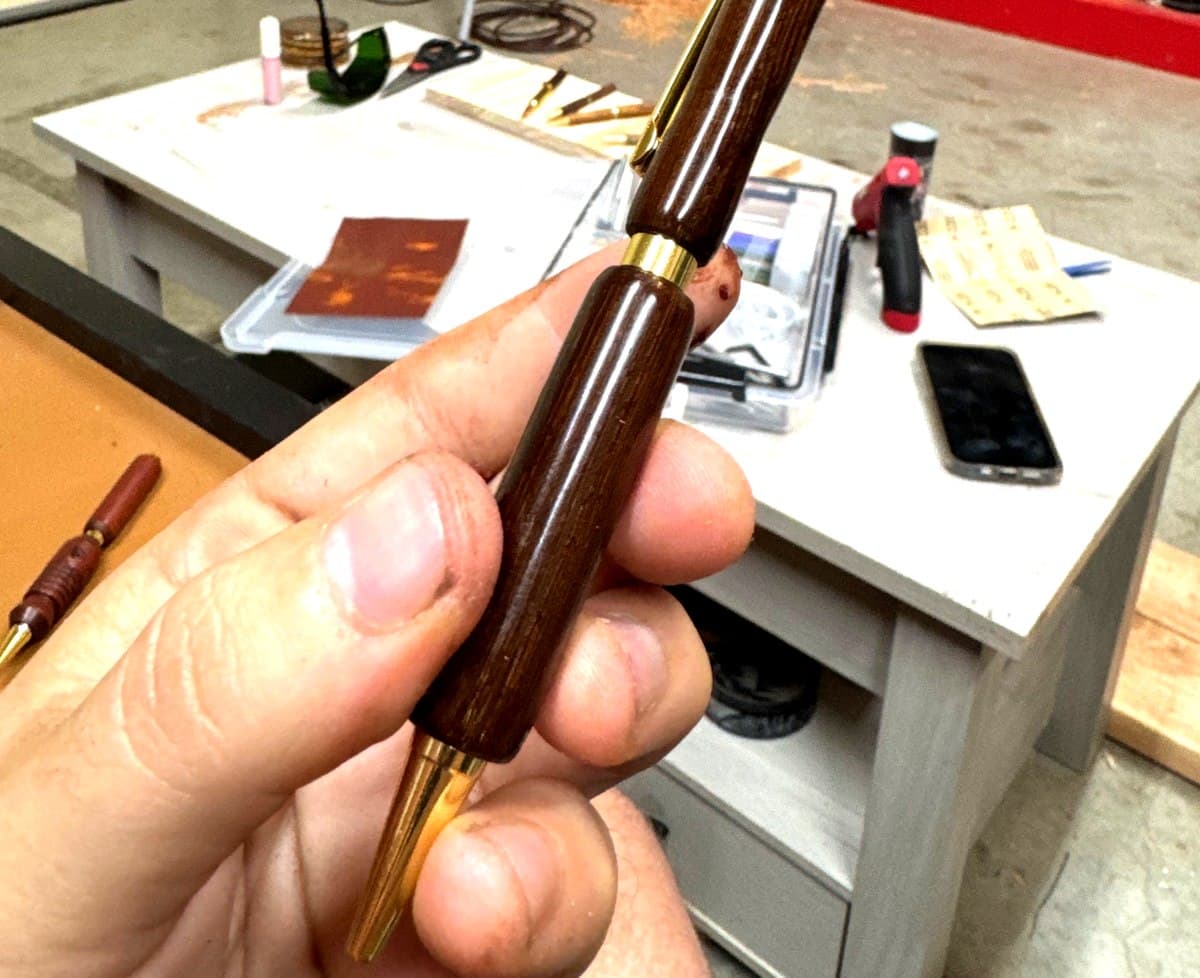 Dark walnut turned pen with gold hardware