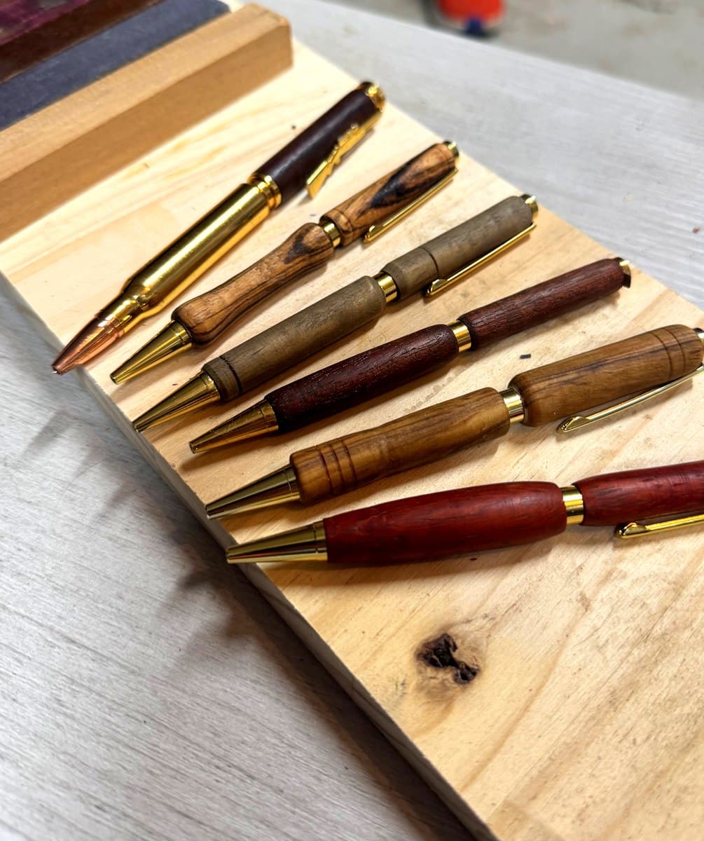 Collection of hand-turned pens in various wood species